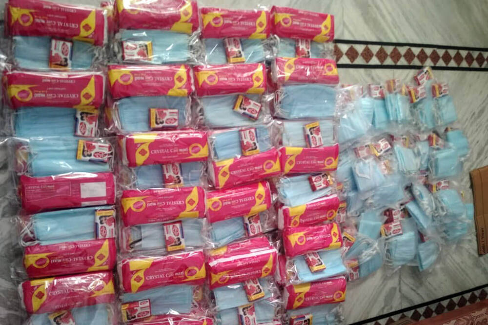 Packaged masks laid out for distribution, Ralawata