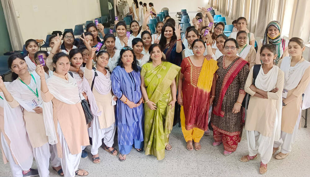Students with free sanitary napkin packets, Anupshahr