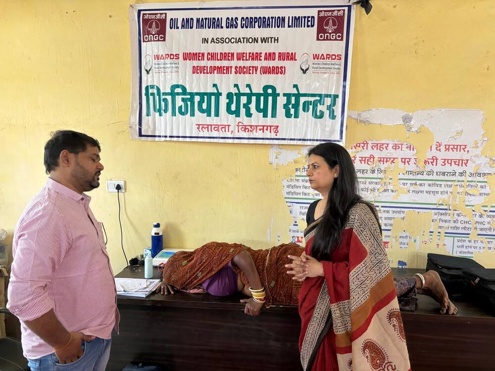 ONGC-WARDS Physiotherapy Centre banner with patient receiving treatment, Ralawata
