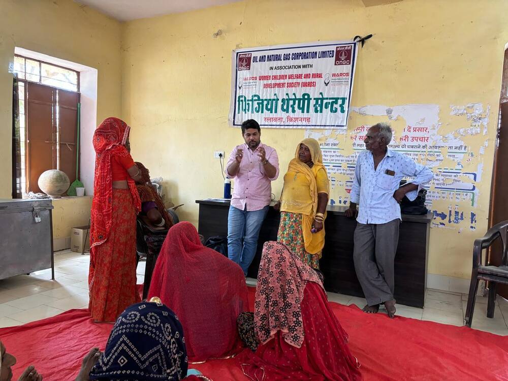 Physiotherapy staff explaining treatment to a patient's family