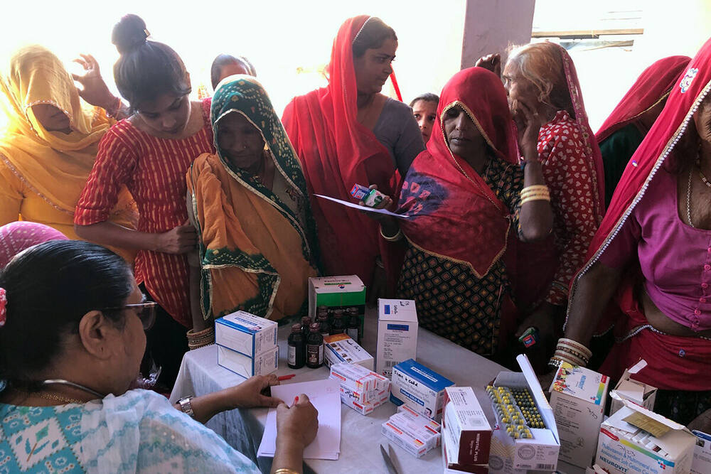 Villagers receiving free medicine at the Sanjeevani clinic, Ralawata